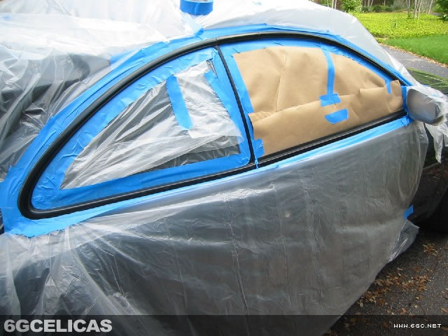 Celica extensively masked for window trim painting showing protective coverage